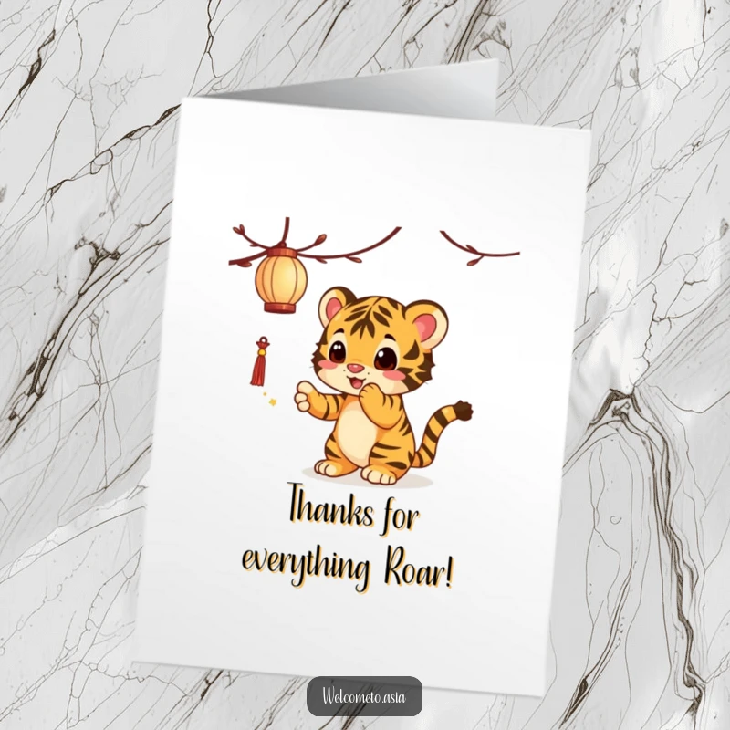 Funny free printable thank you card featuring a curious tiger cub playfully reaching for a dangling lantern, showing thanks with delight.