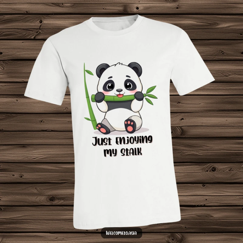 Funny Panda T-Shirt: A cheerful panda character is depicted mid-munch on an enormous bamboo stalk, radiating happiness.